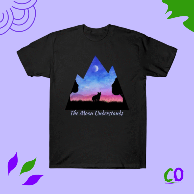 Black t-shirt with geometric mountain silhouette in pink, purple, and blue galaxy gradient, “The Moon Understands” text, travel graphic tee from Creation Overload.